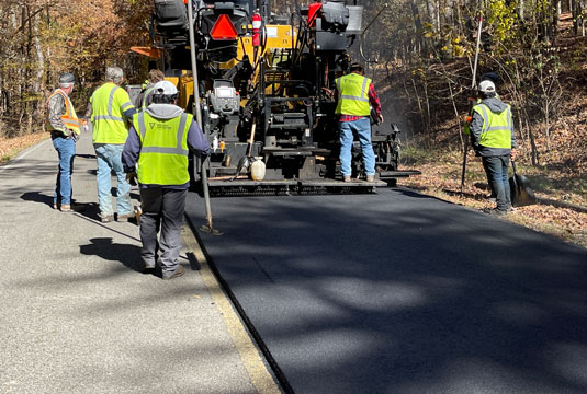 SmartMix being applied to a road by workers
