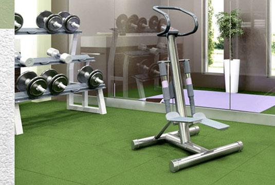 Green SportPlay mats installed in a gym