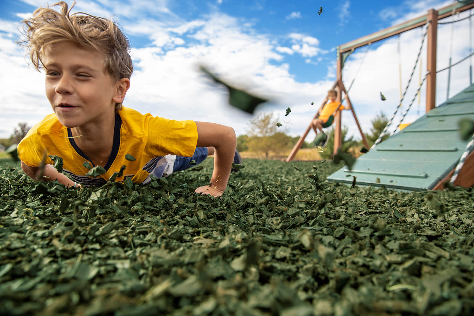 Children Playing in Rubber Mulch Banner
