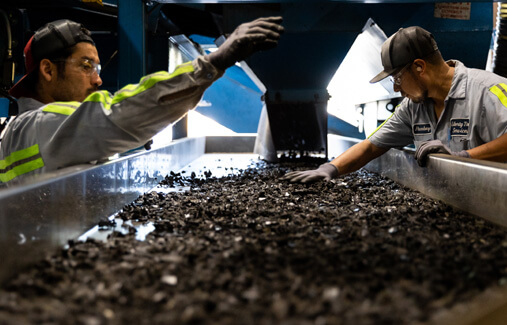 LTR employees sorting shredded rubber 