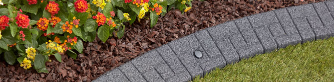 Rubber landscaping blocks bordering flowers