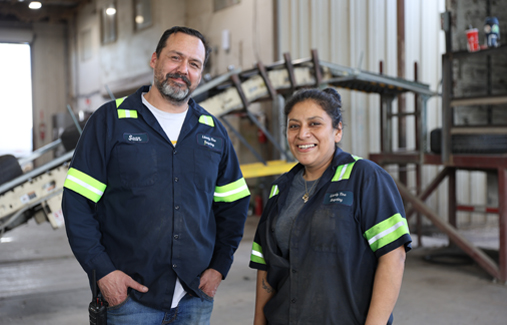 Two Liberty employees smile for the camera